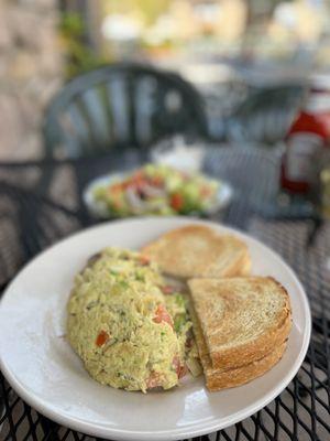 Vegetable omelette with sourdough bread, salad as side dish.