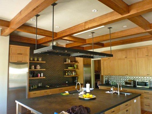 Blackened steel kitchen island rack with recessed led lights for this Silicon Valley home.