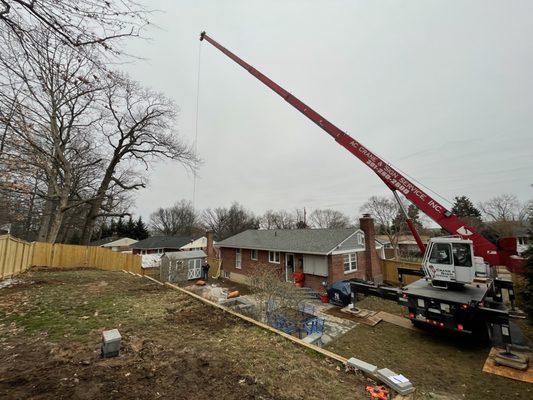 Crane prepping to move shed.