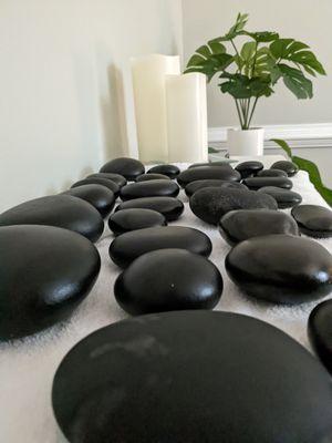 Hot stone massage-the heat from the stones relaxes tight muscles and allows the therapist to work out those trouble spots and trigger points