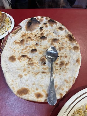 Yemeni tanoor bread is huge! Comparing size with a spoon