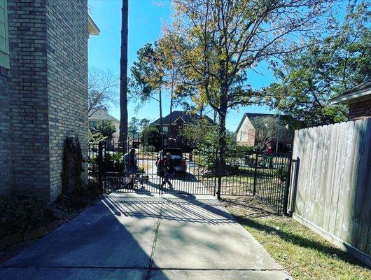 Alex Foto booming, work hard play hard. 12 feet driveway Aleko London style gate, with 5 feet metal fence