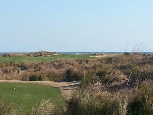 Tee box on hole is 18.  A challenging par 5 with dramatic ocean views along the entire left side of the hole.