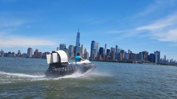 Catching some air in a Hovercraft on a tour of the NYC bat area with a great view of the Freedom Tower.