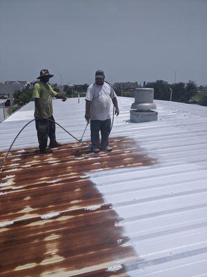 Rust inhibiting primer as base coat to roof