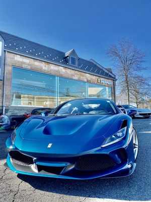 The new Ferrari F8 Tributo in front of the Ferrari/Maserati Showroom