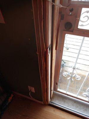 This is the front door. The screen was broken, no handle.  The door frame was broken by the previous tenant.  We witnessed the whole thing.