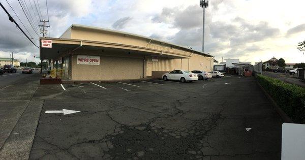 Side parking lot at entrance to new location for ACE Hardware in Hilo. Entrance at 550 Kilauea Ave, exit on Hualalai St.