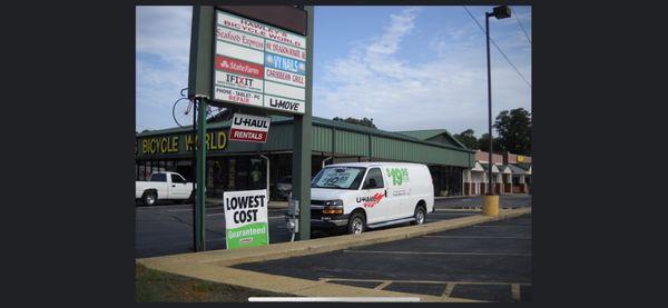 Strip mall sign & van