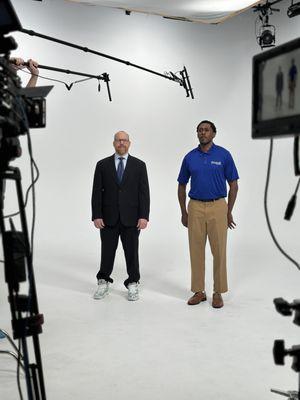 Two actors in a fully setup studio recording for a commercial