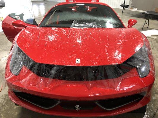 Ferrari 458 getting a full front end Paint Protection film with our XPEL product to protect the paint from rock chips.