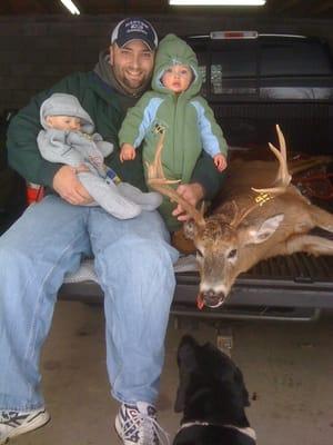 Bill's Shares his 9 point buck with his to sons.