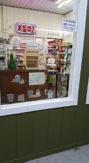 Side window of store, showing inside main room