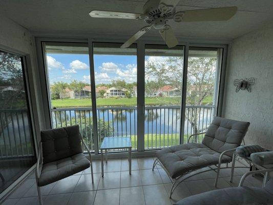 Enclosed patio with a ES-EL400 Elite Impact Sliding Glass Door.  White frame insulated.  At Your Service Windows & Doors