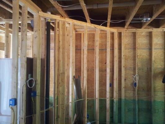 Roughing in wiring before city inspection and drywall is installed. This is a New construction home being wired.