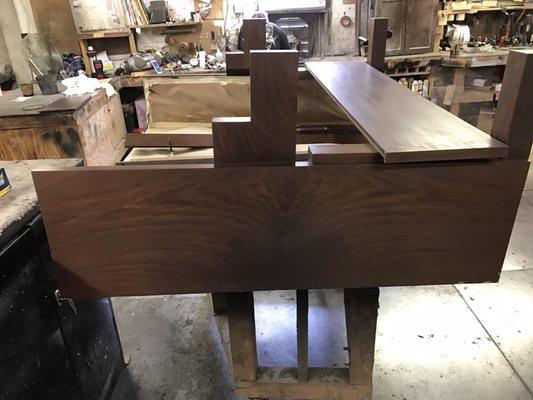 An original Cunningham player piano is being stained and refinished.