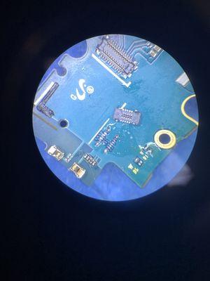 A damaged connector soldered off of the board of a phone. We installed a new one shortly after. The phone worked great after.