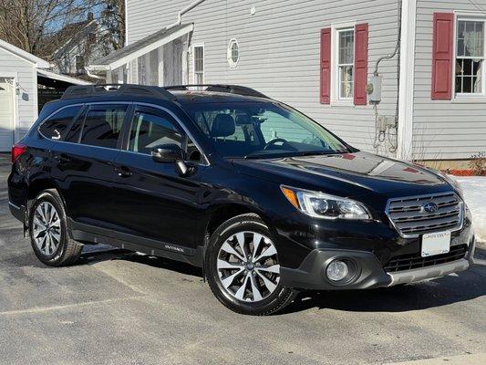 2016 Subaru Outback 2.5i Limited with Crystal Black Silica paint.