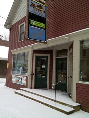 Front door and green sign