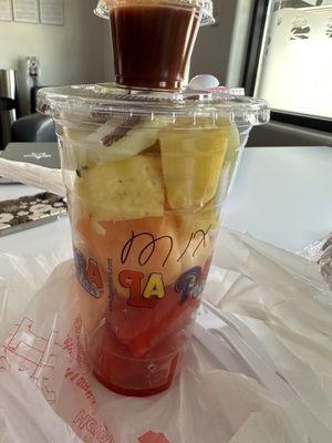 Fruit cup with chile on the side.