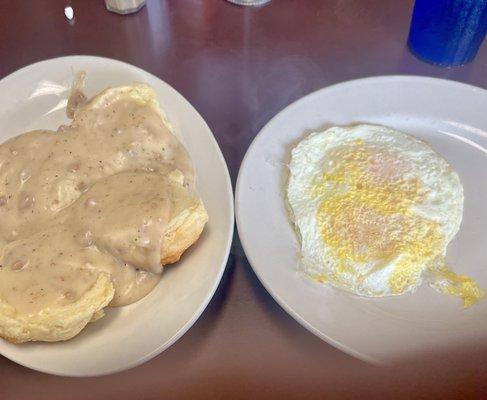 2 biscuits with sausage gravy ( where is the sausage?) and 2 eggs supposed to be over easy.