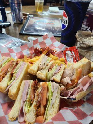 Snack bar doing a really nice club sandwich.