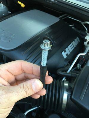 This is the bolt that was left inside of the engine compartment by the mechanic.