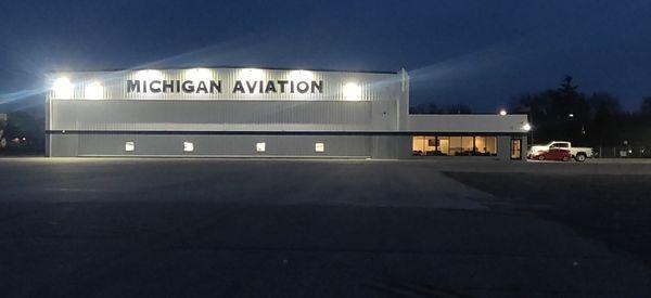 An evening shot of the newly renovated hangar facilities and executive lounge.