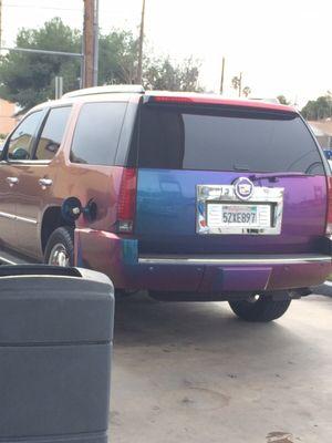 Whoa! Gorgeous paint job on this vehicle filling up by me. It changes colors depending on the angle!