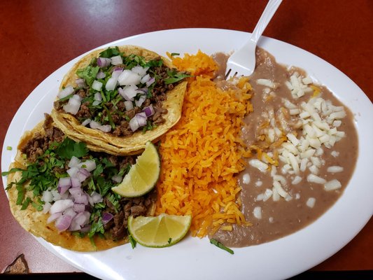 Carne asada tacos with rice and beans