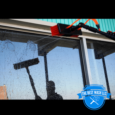 Rinsing the window with deionized water after it's been scrubbed.