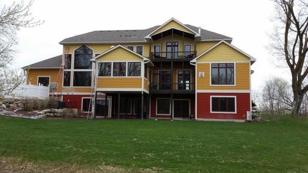 Gutter project on new house with fun roof lines