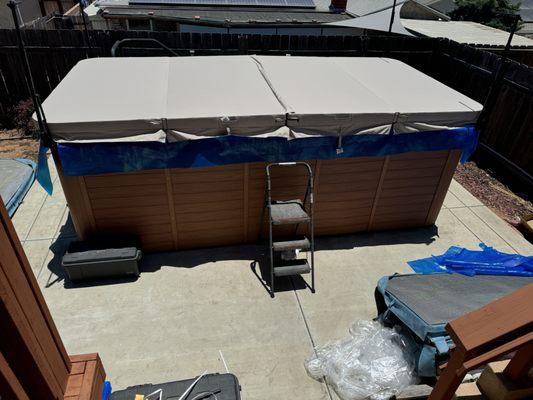 New 4 piece swim spa cover.  There is also a blue solar cover underneath.  Not fully installed - Cover Lift and hold downs not attached.