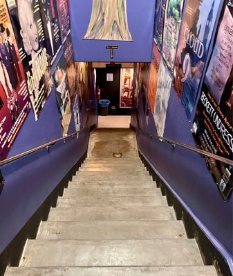 Down the stairs to the bar and bathrooms. There is also an elevator.