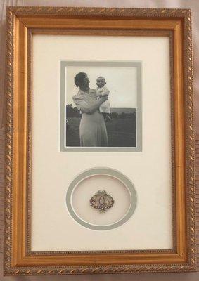 A shadowbox with my grandmother's photo (holding my 80 year old brother in 1942) and her favorite brooch