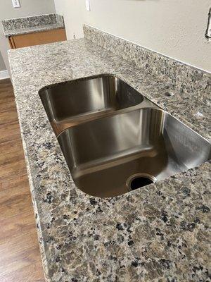 Free sink - they drill holes based on faucet selection.