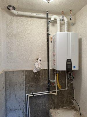 New tankless water heater unit! Please disregard the rag on the wall