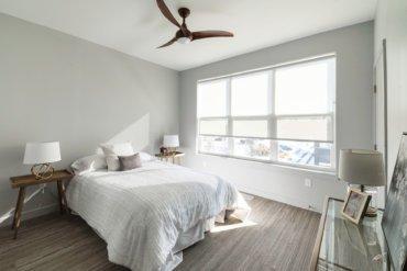 Master bedroom in our 2-bedroom townhome; with a spacious walk-in closet and luxurious en suite bathroom.