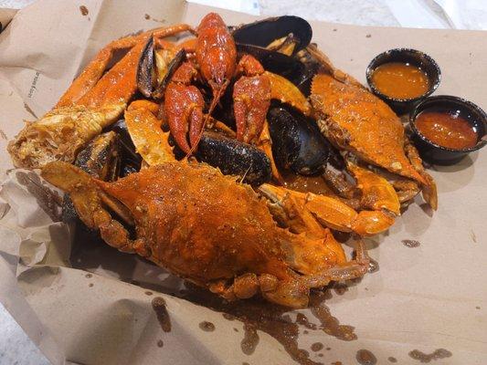 Blue crab, snow crab, mussels, crawfish, Crack sauce, spicy sauce, fortune cookie.