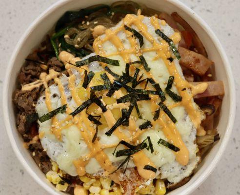 Bowlbop - assorted ingredients on top of rice including fried kimchi, bulgogi, egg with mozzarella cheese, vermicelli noodle and much more