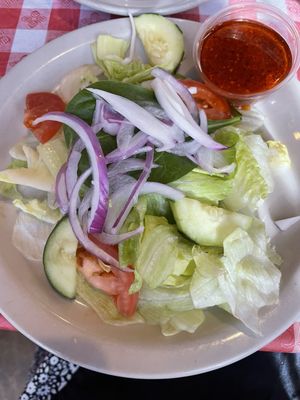 Salad with house tomato basil vinaigrette. Very fresh.