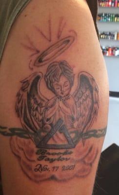 This is a memorial tattoo for my Baby Girl... Mike did a great job.....