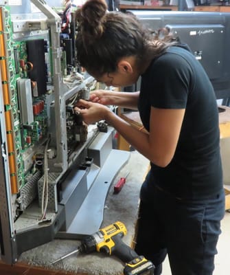 Sandra working on an LG plasma main board.