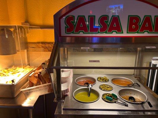 Chips and Salsa bar -All four sauces are are made different have different spice levels.