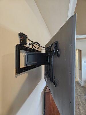 Custom TV mounting with clean wiring