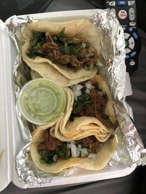 Top is a carnita taco and the bottom two are birria tacos.