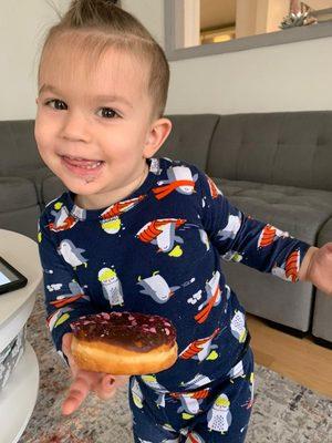 Joseph trying to act cute with donut