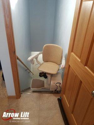 This stair lift was installed to end just short of the doorway allowing the homeowner to leave the door in place.