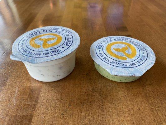 Yogurt dressing on left, green hot sauce on right.