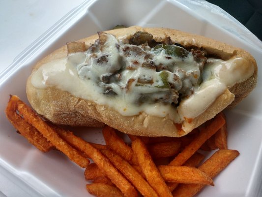 Philly cheese steak with sweet potato fries.